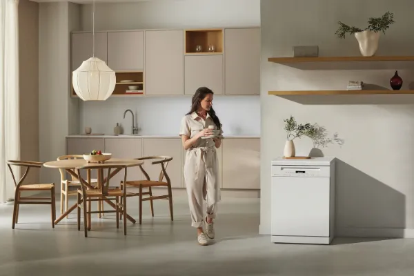 Miele G7130 SC Freestanding Full Size Dishwasher with AutoDos in White_room view